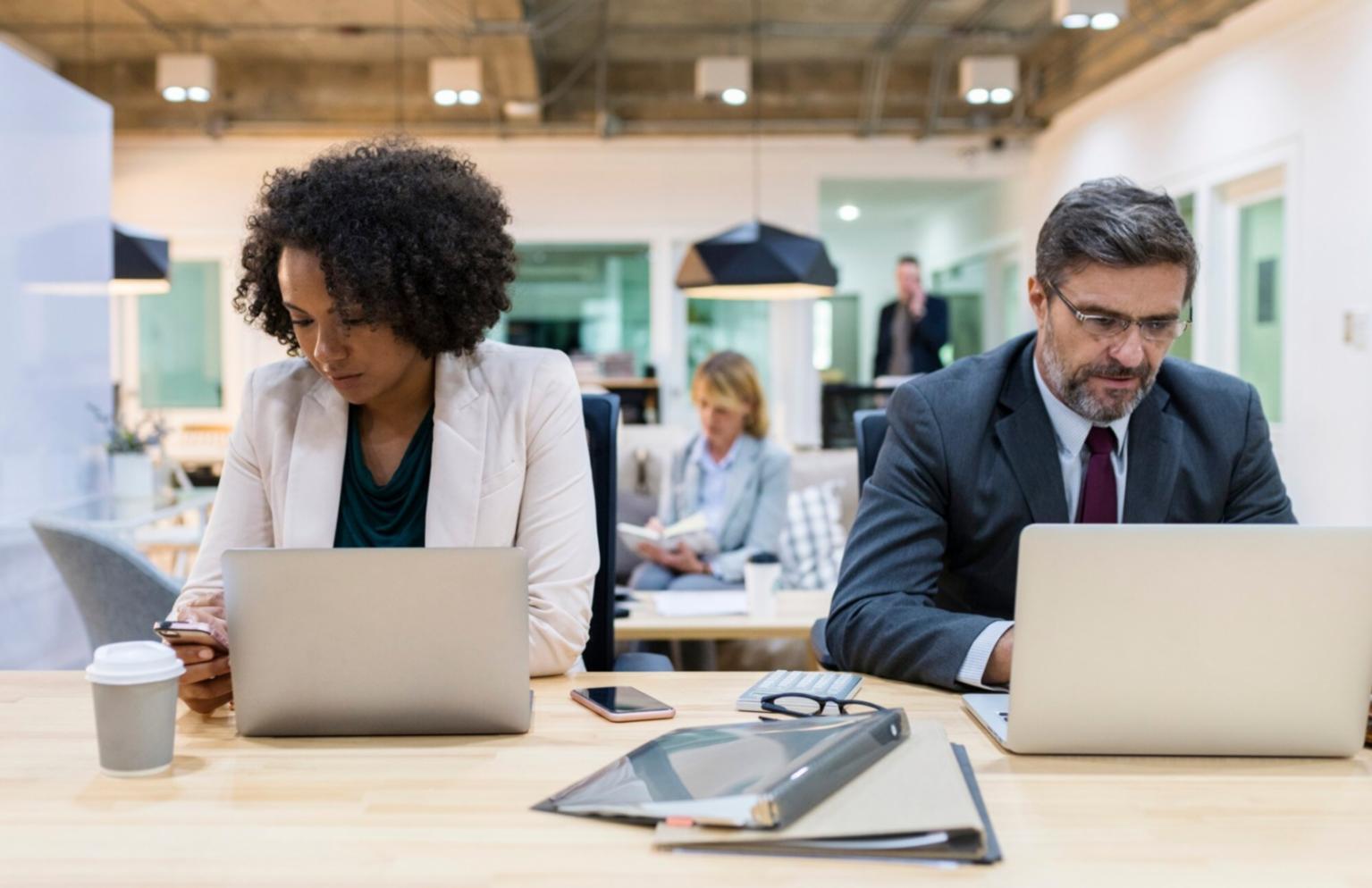 Business professionals engaged in collaborative financial analysis workshop
